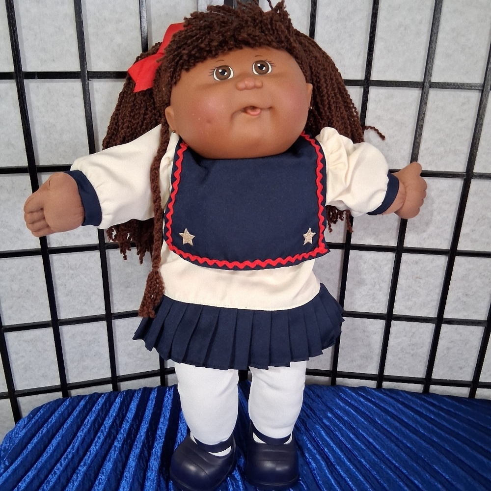 Charming Navy and White Doll with Red Bow